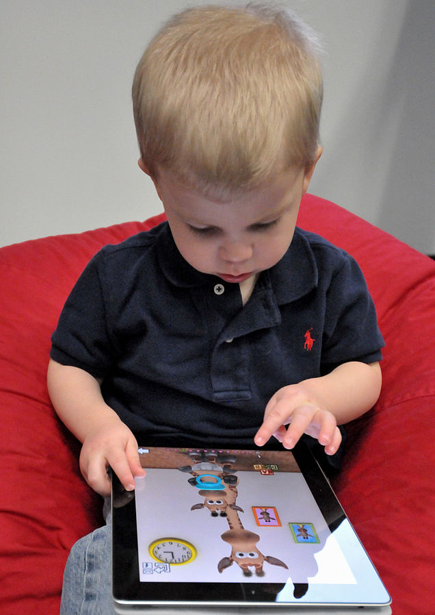 kid with ipad