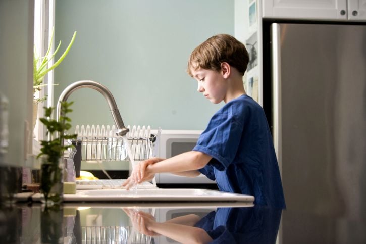 boy washing hands 