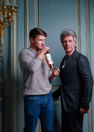 bon jovi and his son with wine