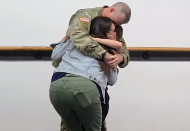 boy spars with deployed dad