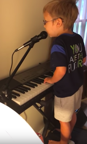 blind boy playing piano