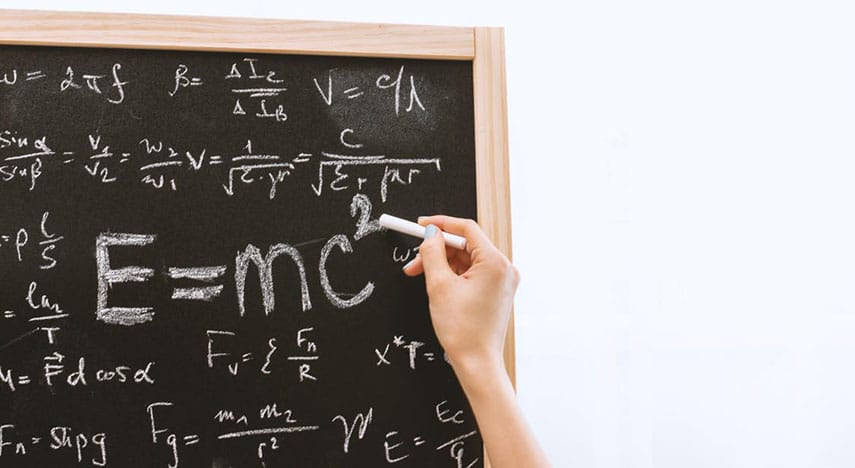 Writing math problems on chalkboard