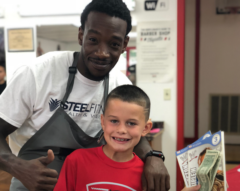 barber pays kids who read book during haircuts