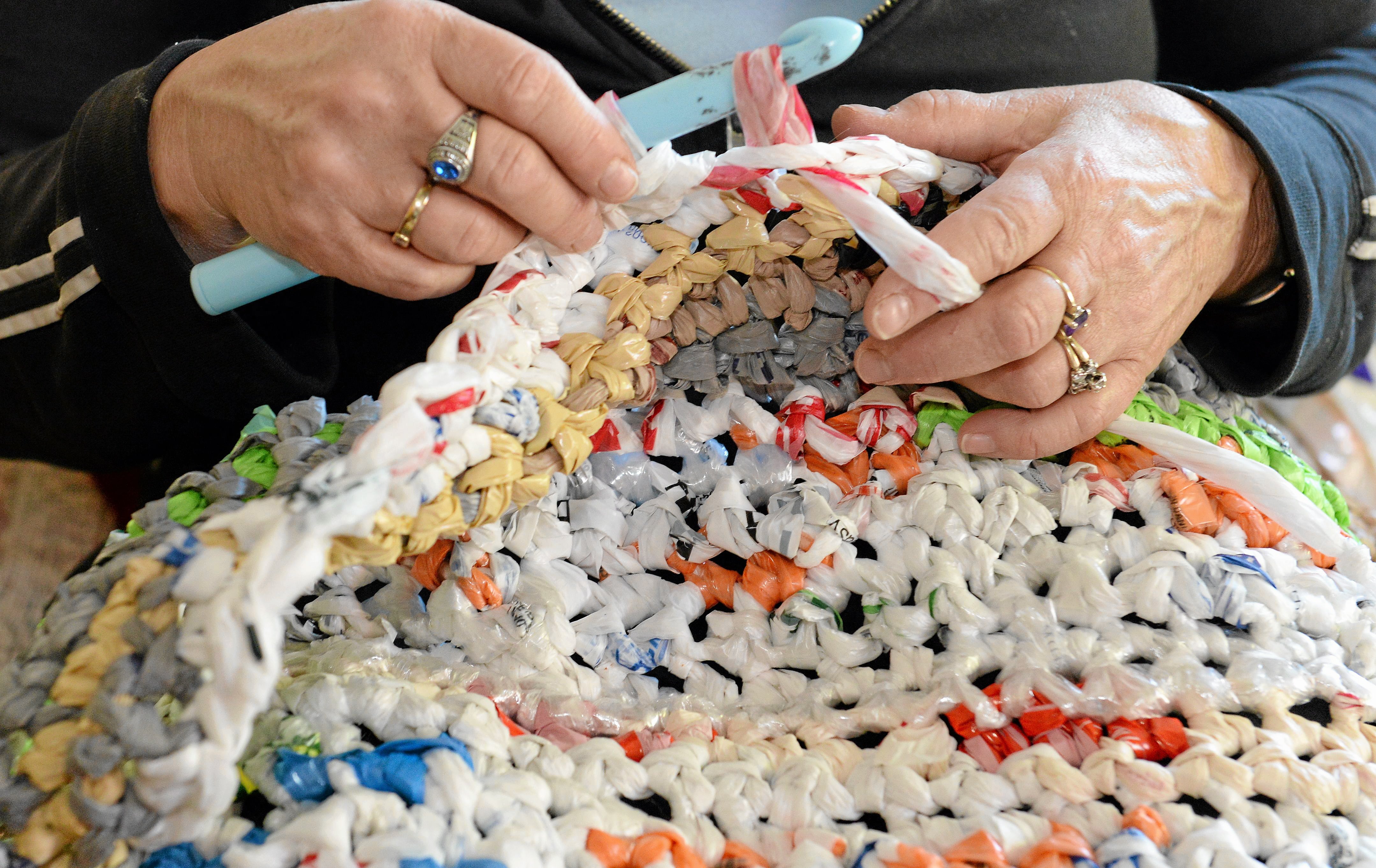 high school students make sleeping mat out of plastic bags