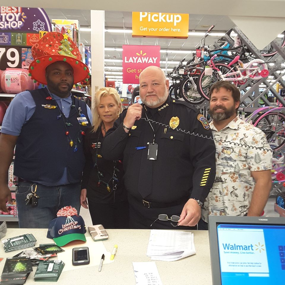 police officers paying off layaway accounts at walmart