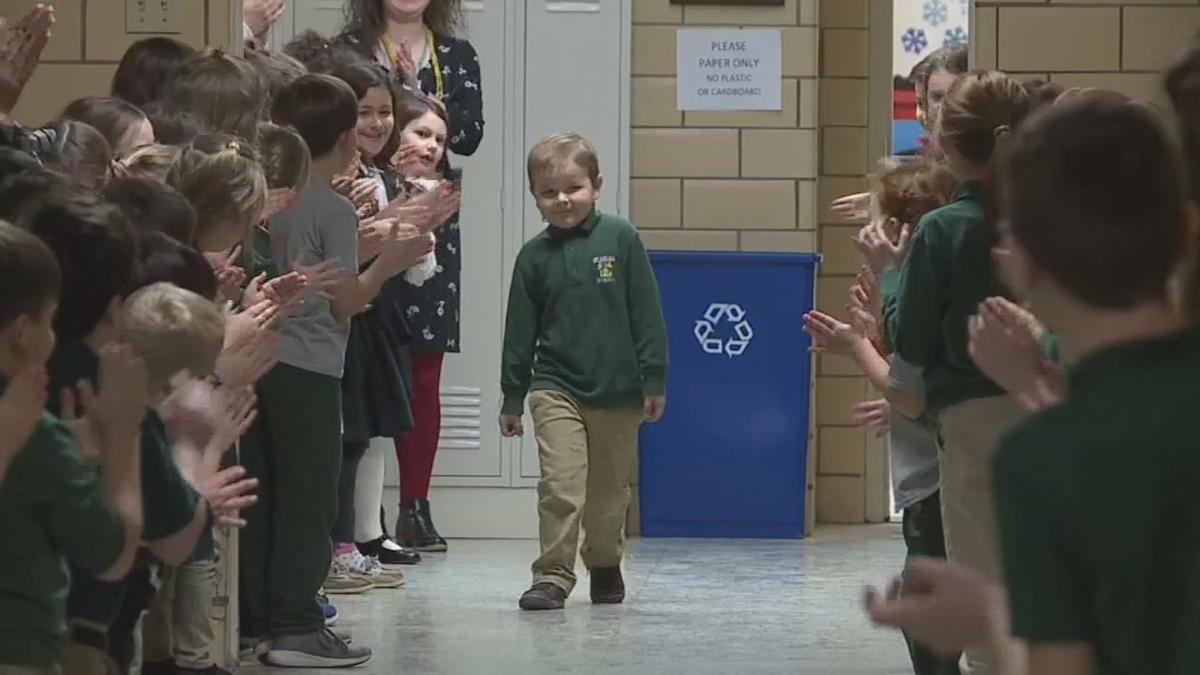 6 year old boy gets standing ovation from classmates after beating cancer