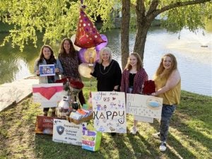 Carolyn's family brought cards and celebrated with her from a safe social distance