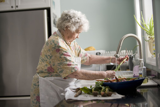 grandmother washing vegetables 
