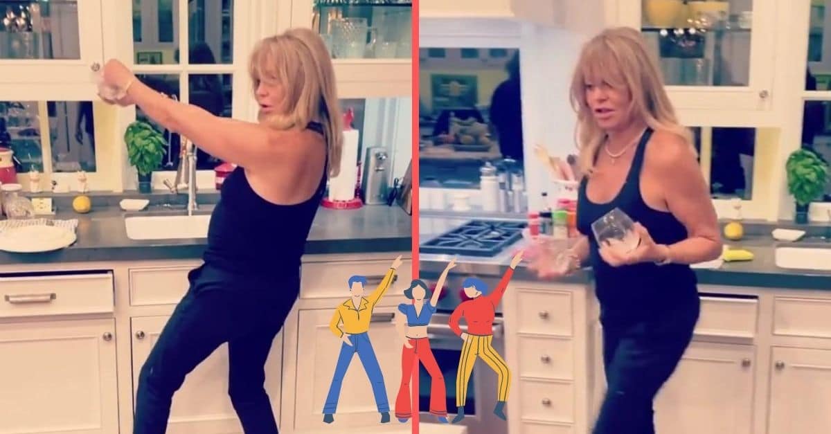 Goldie Hawn dances while doing dishes