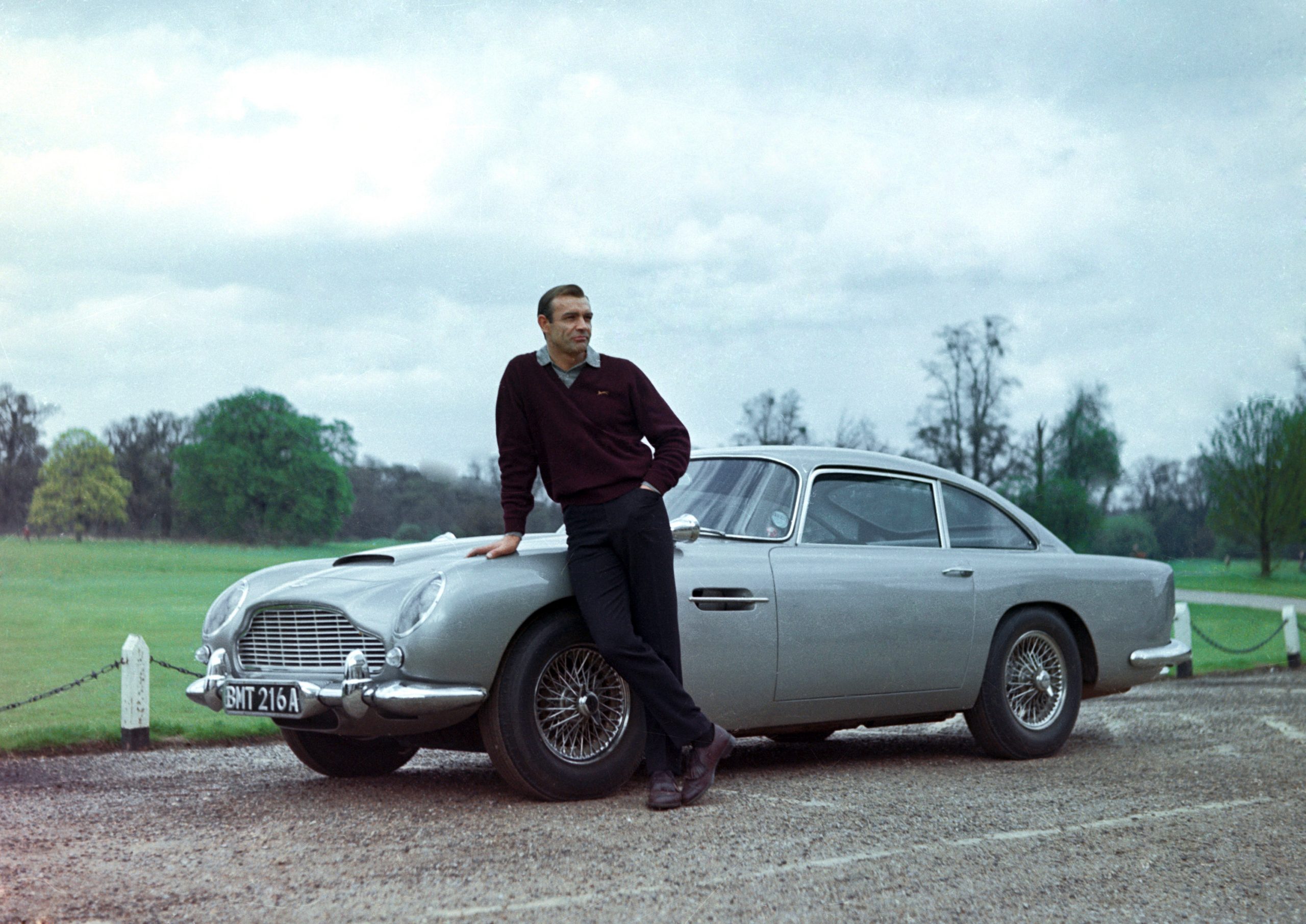 Sean Connery in Goldfinger, which introduced the Aston Martin DB5 as a popular Bond car